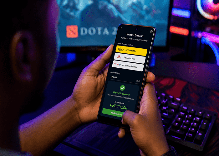 Ghana gamer using mobile money betting deposit app.